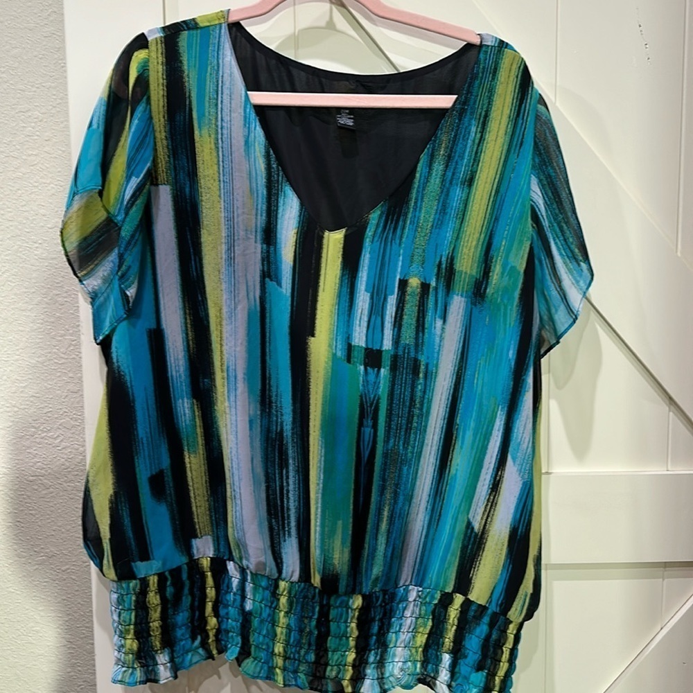 Alfani top. Blues, whites, greens. Elastic at bottom. Sheer sleeves